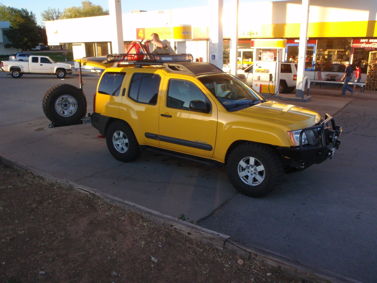 Joel fixing the fuel can to the roof.