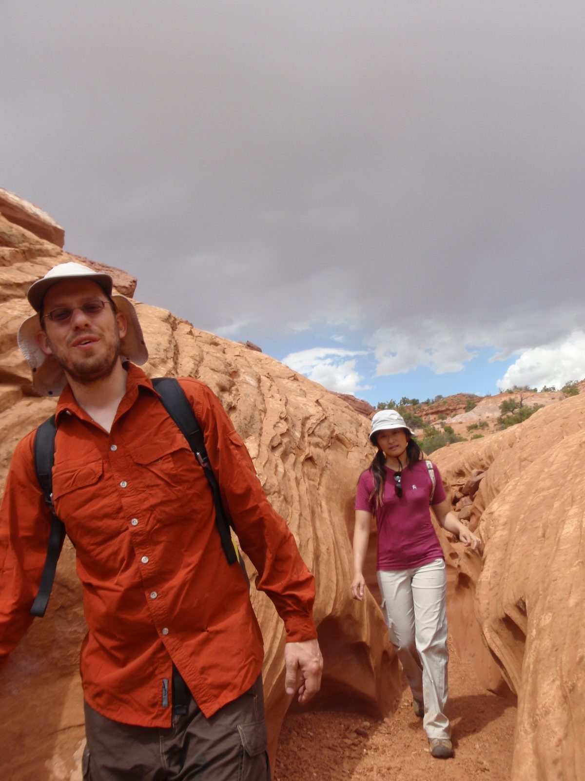 Joel and Turtle, hiking under an ominous sky.