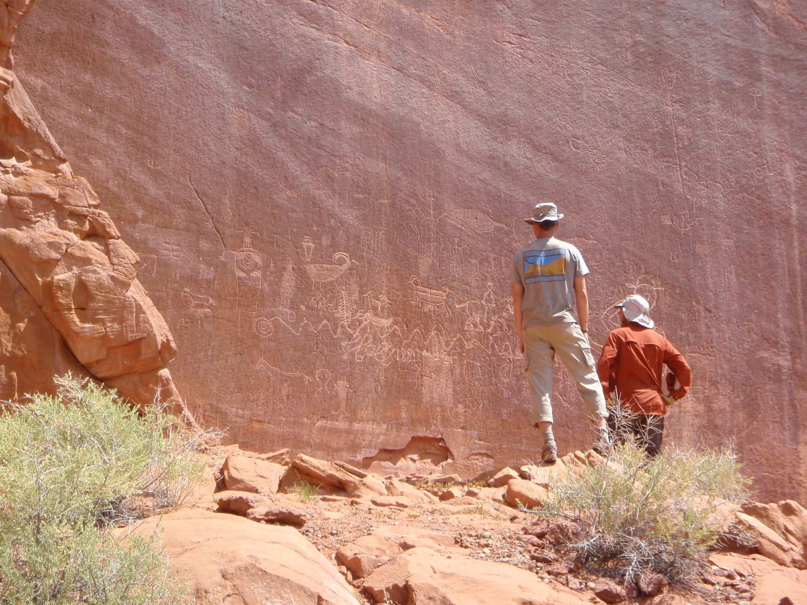 Andy and Joel study some Native American petroglyphs.