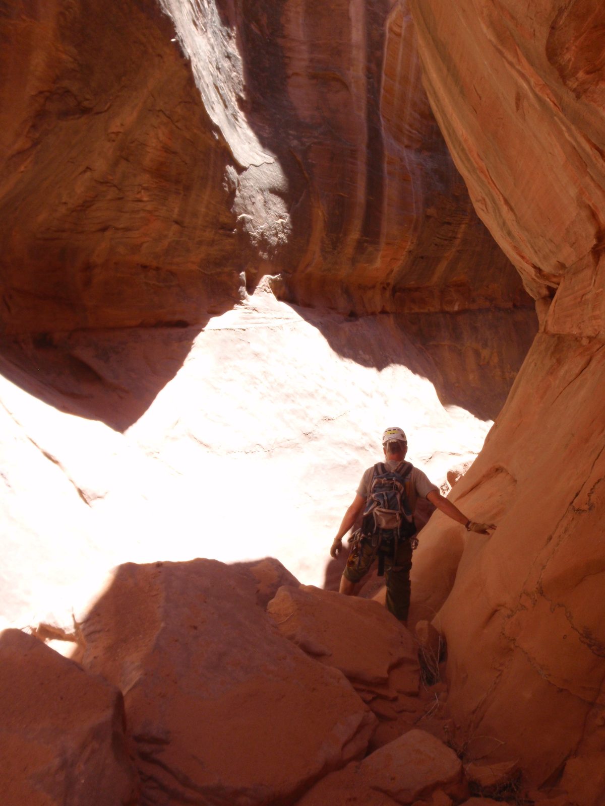 Andy, navigating some boulders in Boss Hog Canyon.