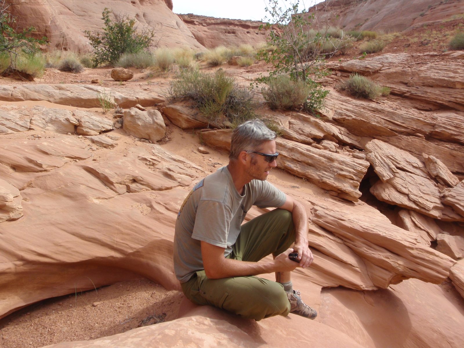 Andy sitting near the top of Lucky Charms canyon.