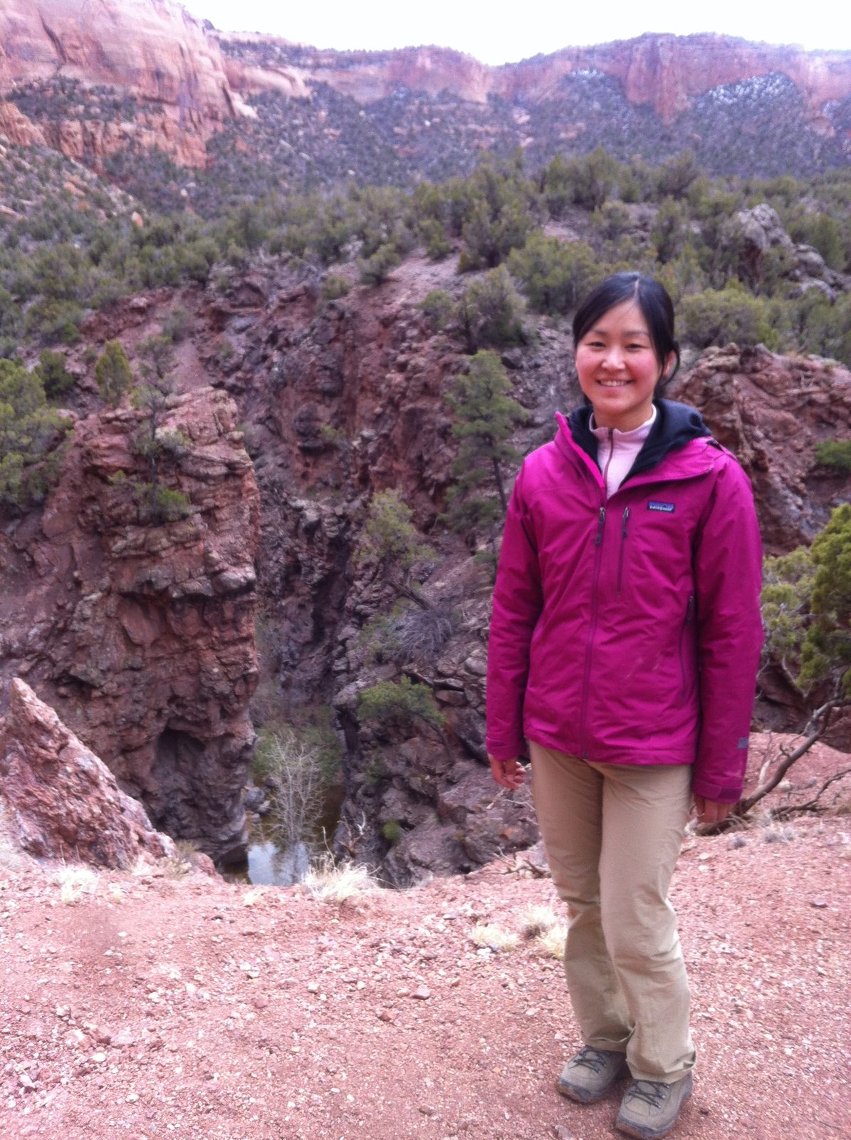Monica with some precambrian sandstone in the background... along our hike through Ute Canyon.