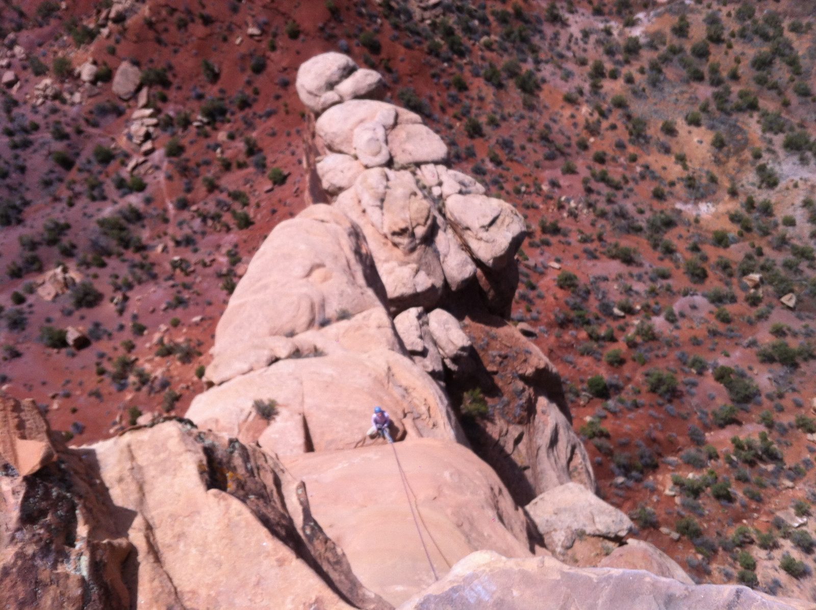From the top of the 4th pitch, looking down at Monica belaying. Lunch box ledge sprawls toward...