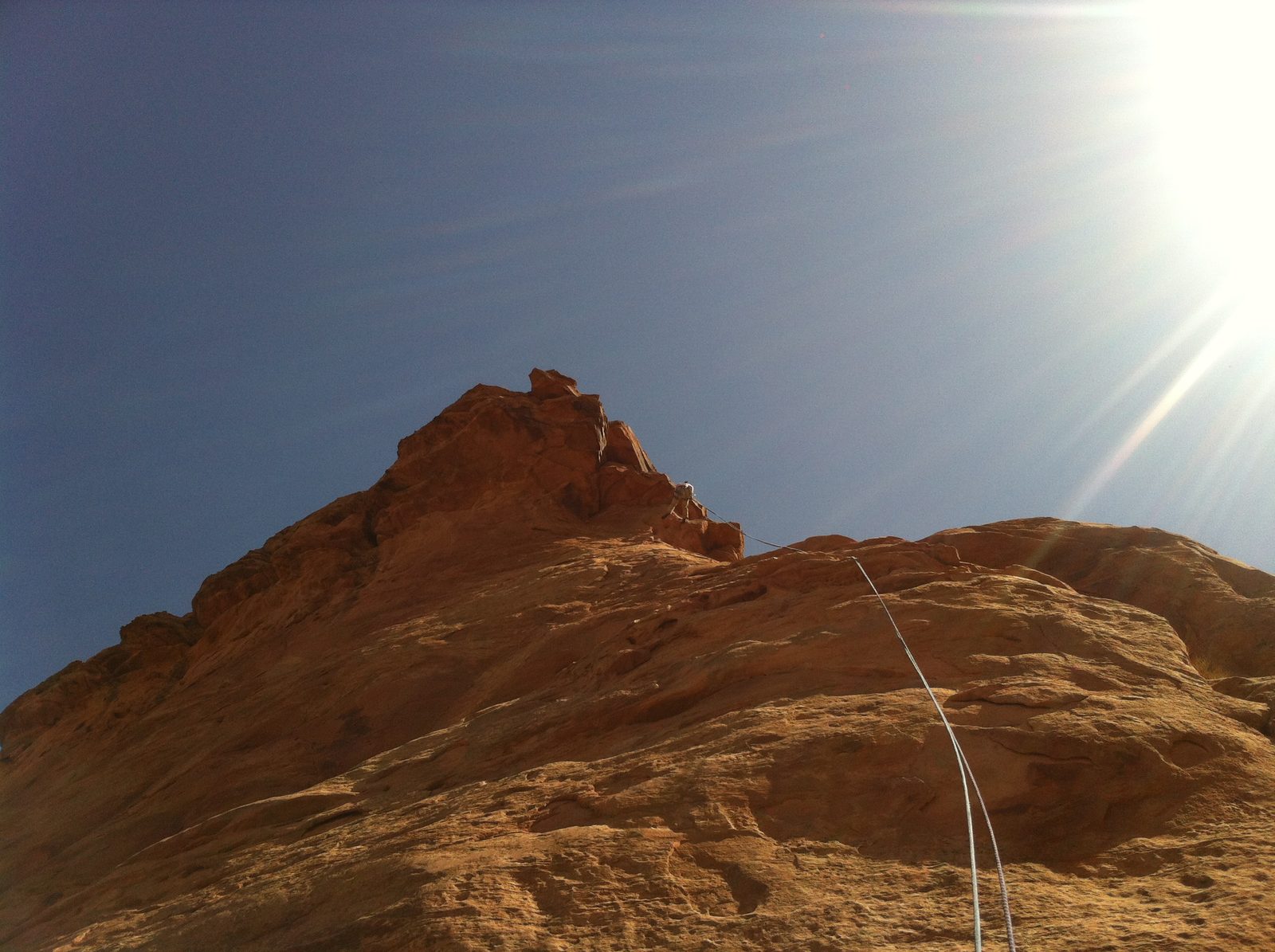 Monica on rappel from (10 feet below) the summit.