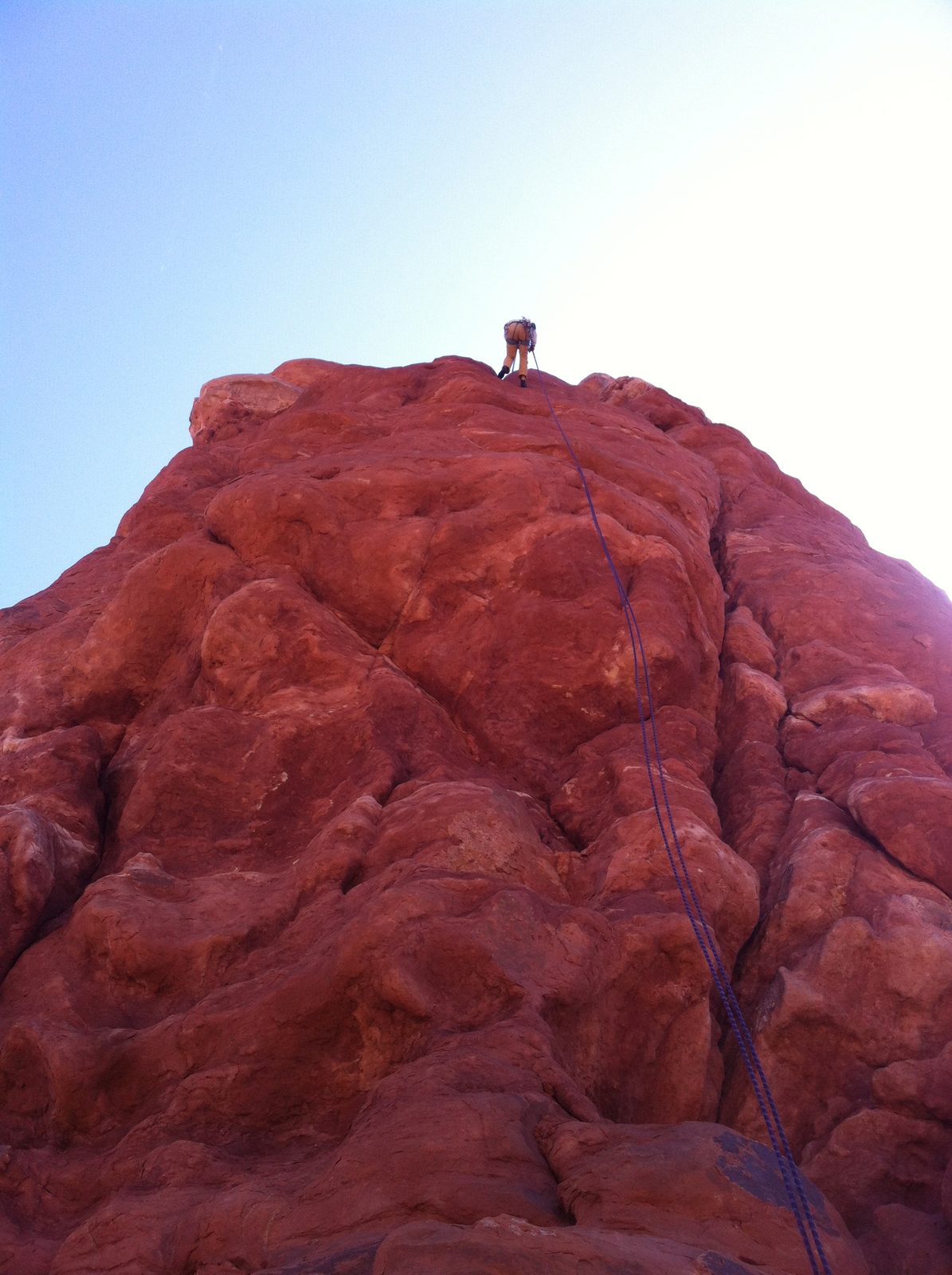 Monica on Rappel from Owl Rock -- sort of looks like is made from compacted mud, but is actually...