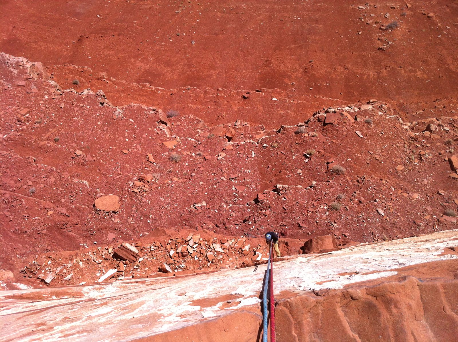 Monica on rappel from the top of the tower. Check out the interesting calcite "varnish" on the...