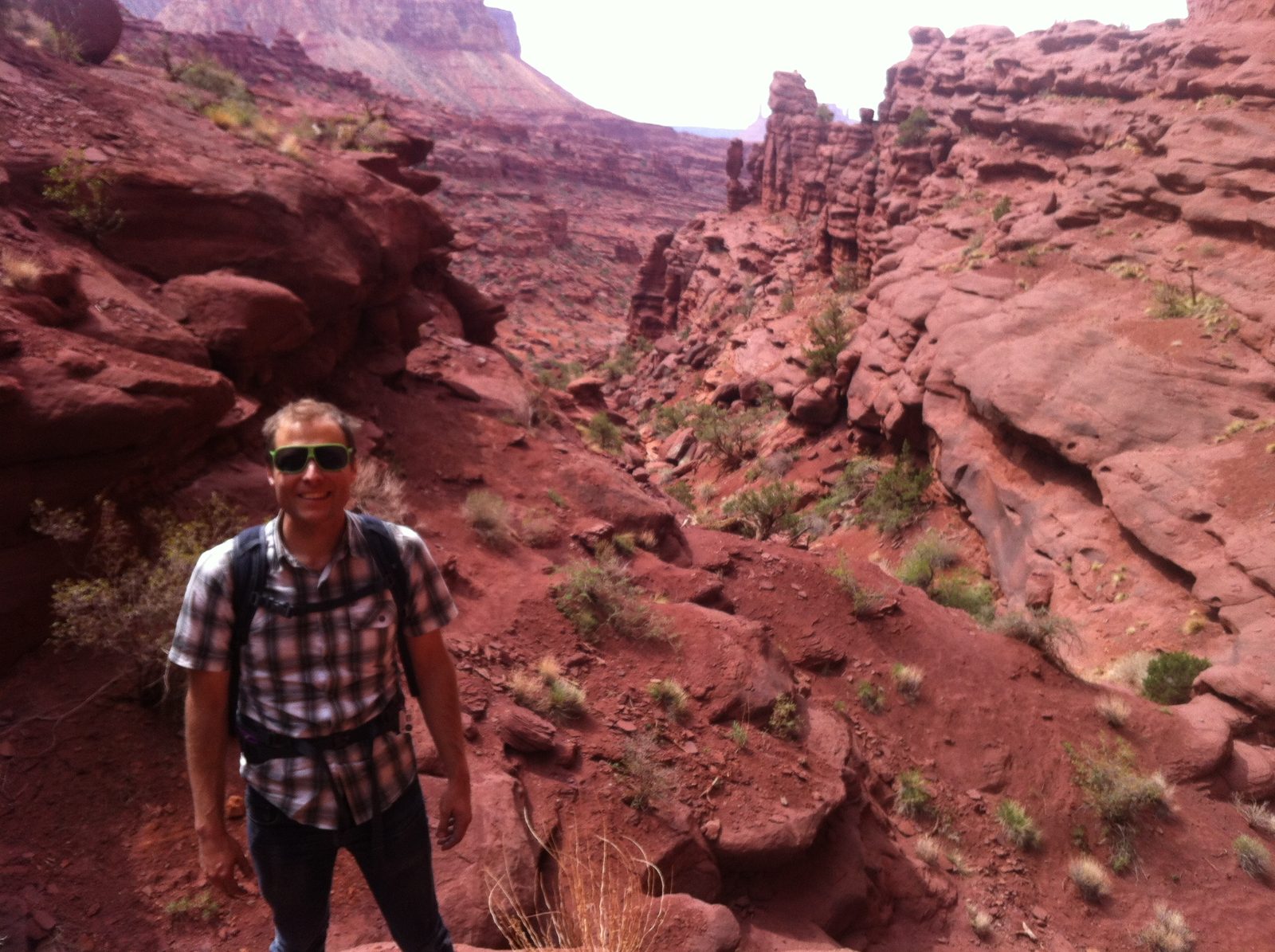 John hiking at Fisher Towers.