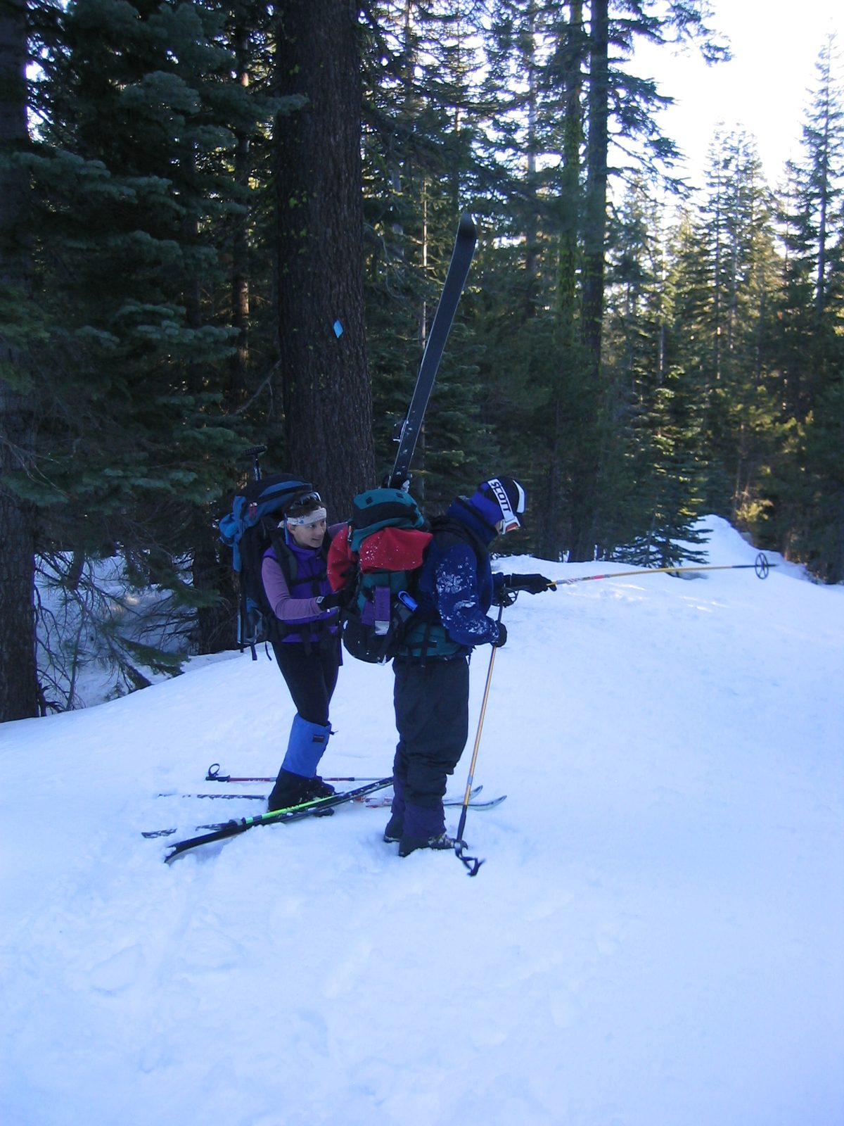 Glenda, helping Michael attach a ski to his pack for the final haul to Van Vleck Bunkhouse.