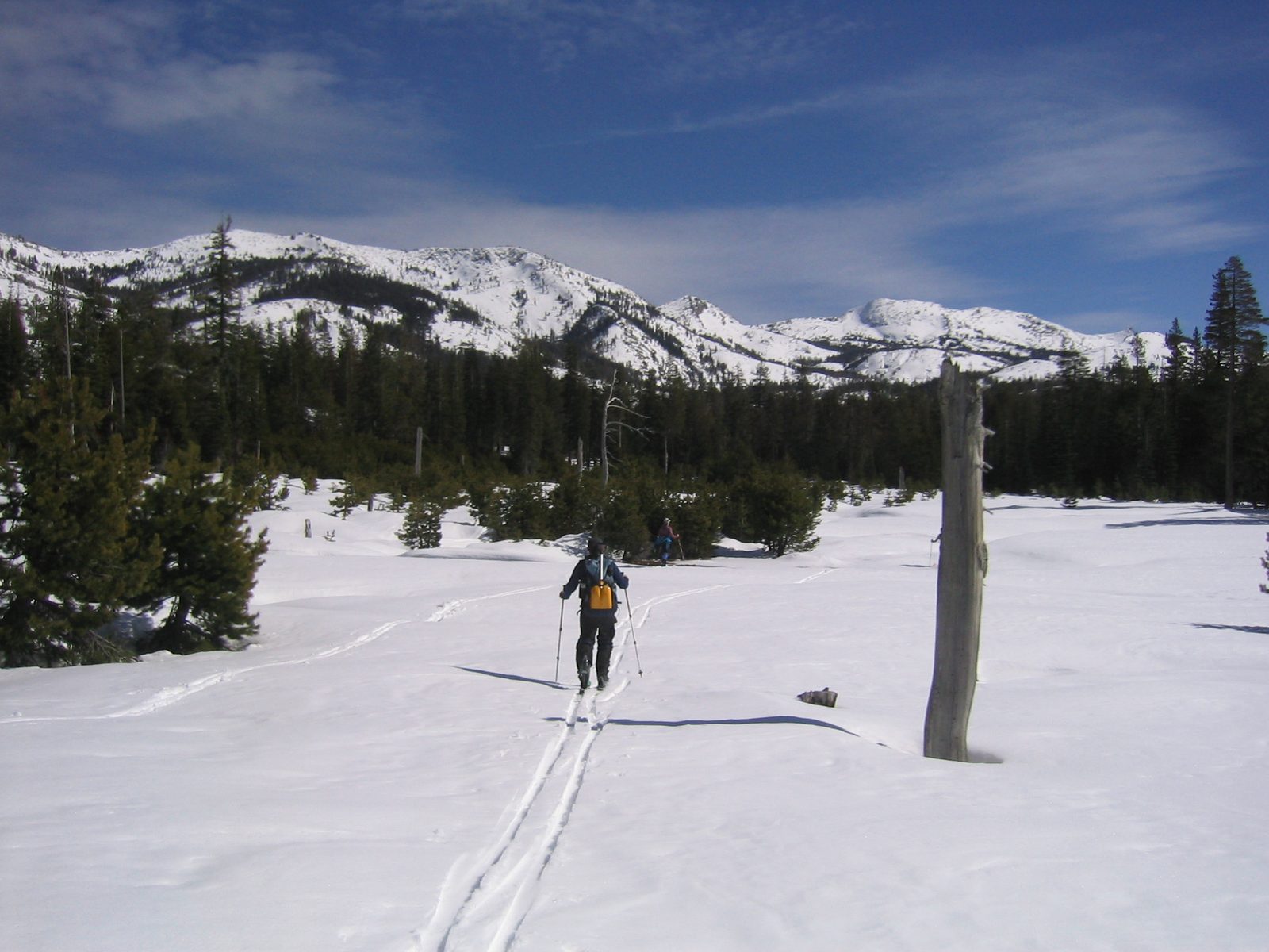 Niels and Glenda crossing a snow-covered meadow on our way to the foothills of the Crystal Range.