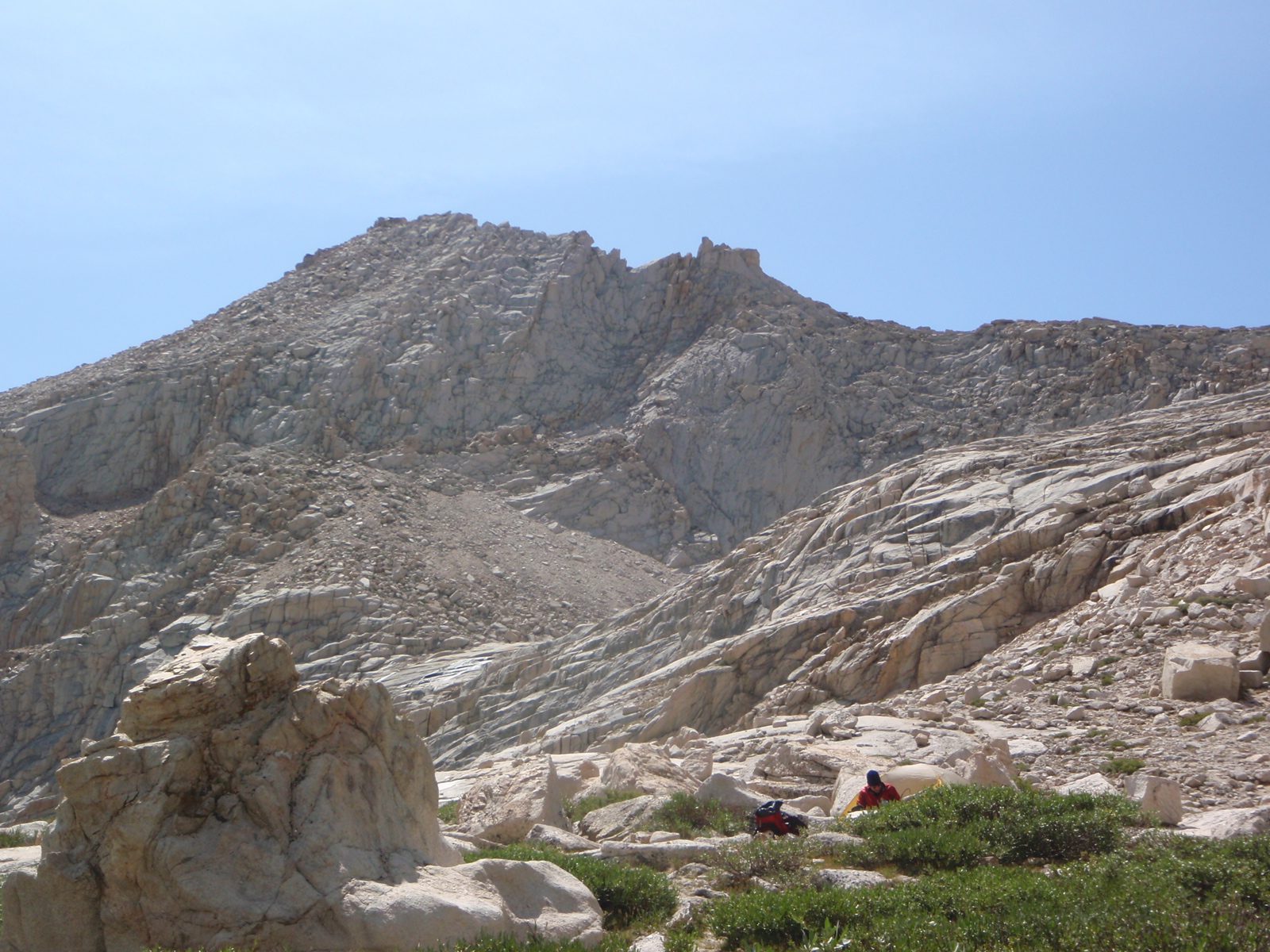 Joel, preparing for our ascent of Mt. Russell.  Our camp is at the right; where we put our food...