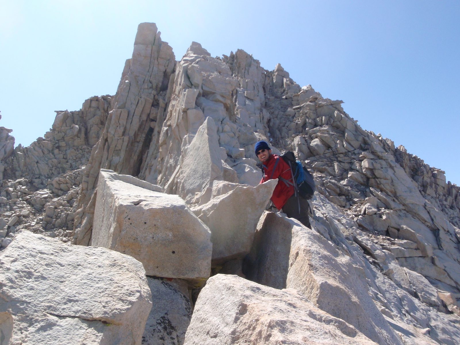 Joel pausing to smile for the camera on the East Ridge of Mt. Russell.