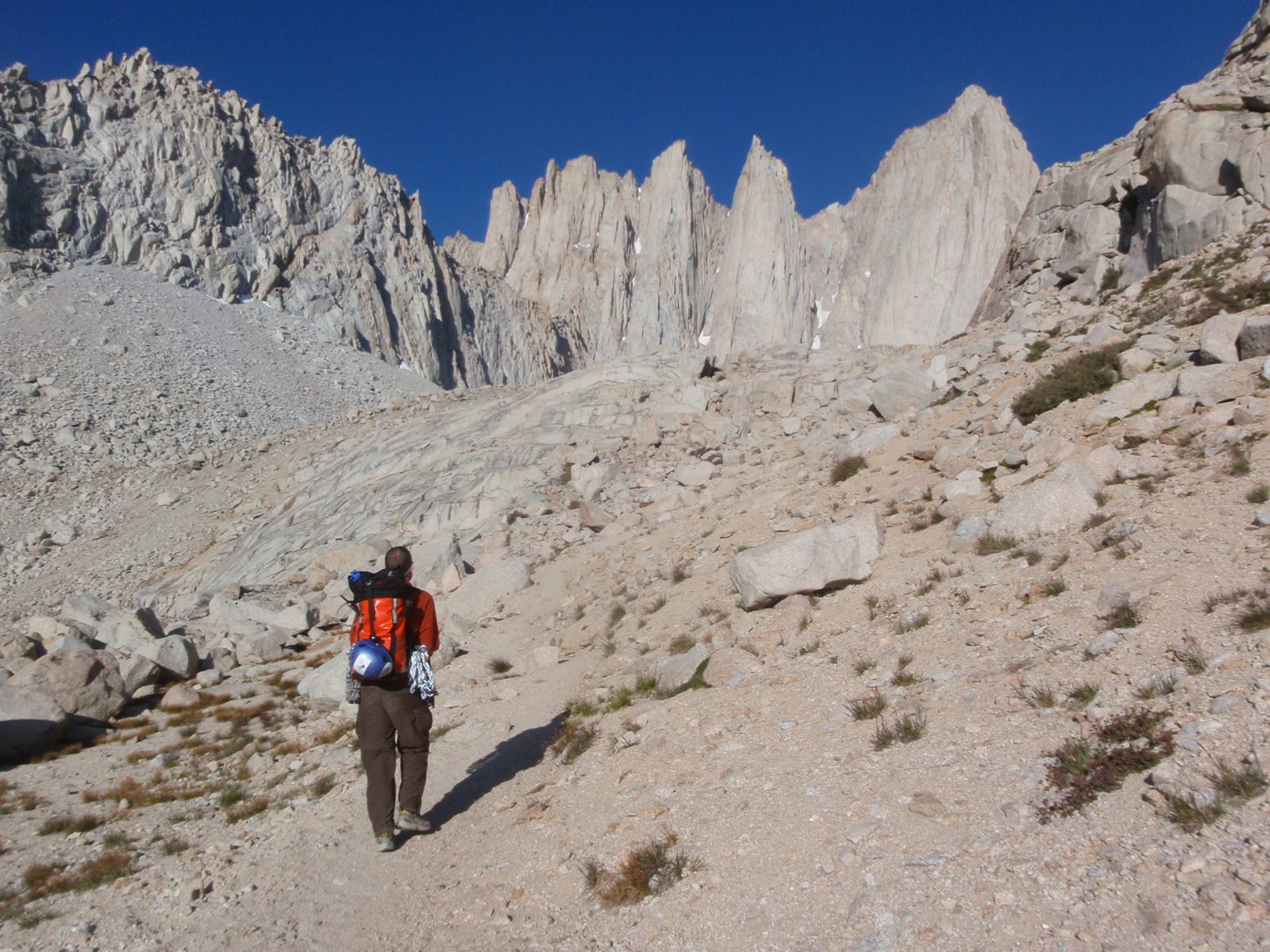 Day 3:  Joel, weighed down with climbing gear, starts the 2 hour hike from our base camp to the...