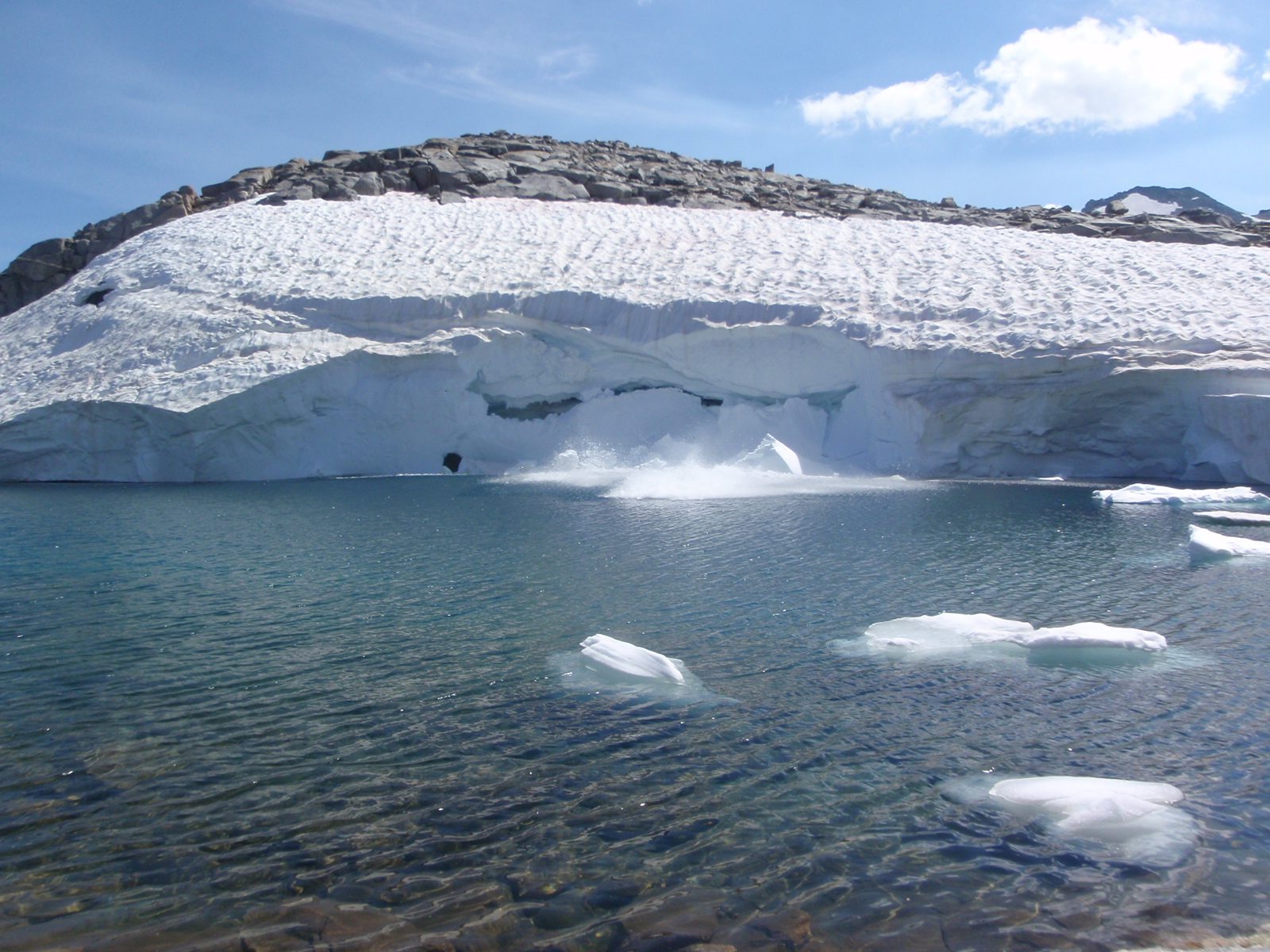 Cra - cra - cracck ... groan... kablooosh!!  A piece of this glacier easily the size of a large...