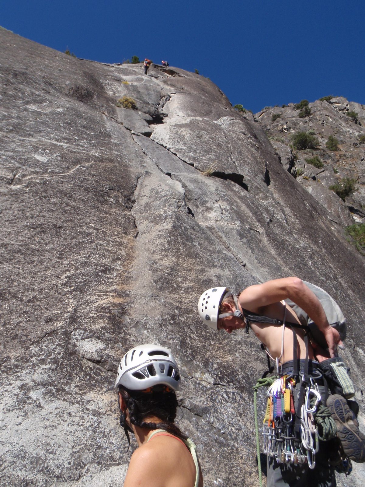 Philip and Heather and the cluster - of climbers above us. Philip and Heather work at the new...