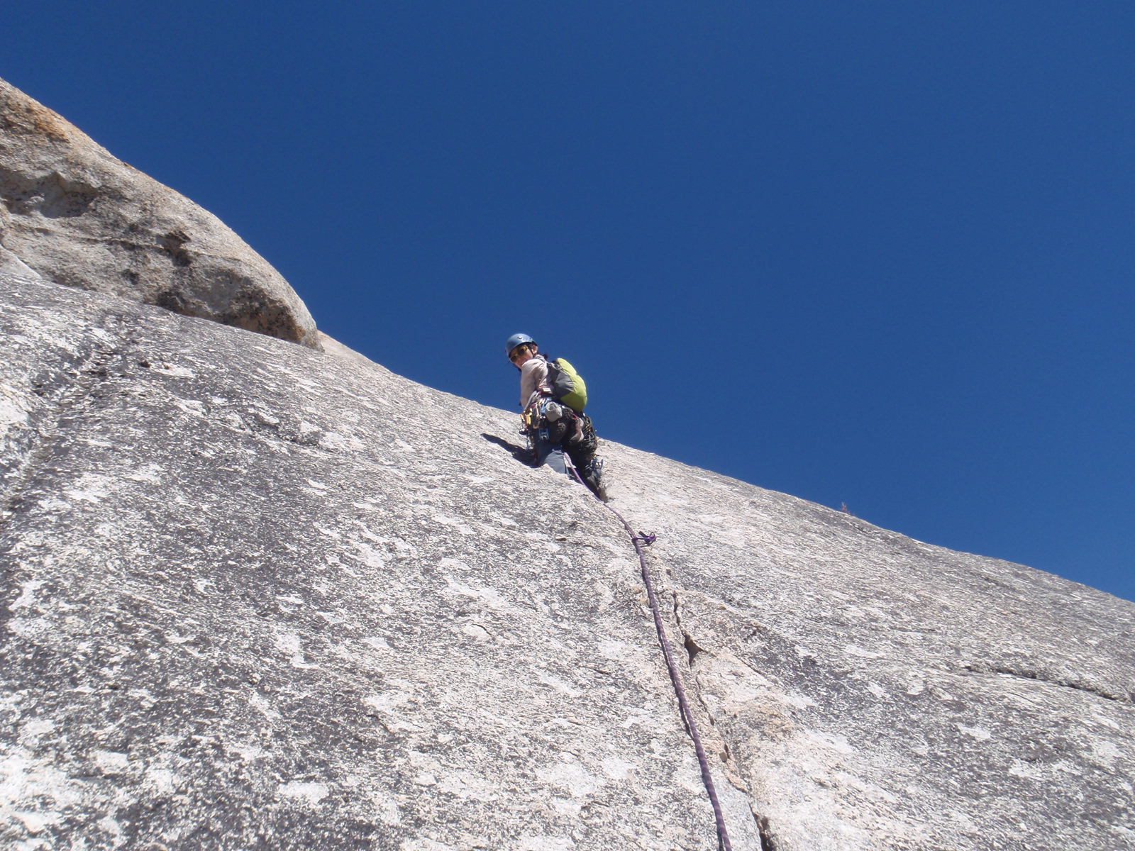Monica on the sharp end of the rope on pitch 4.