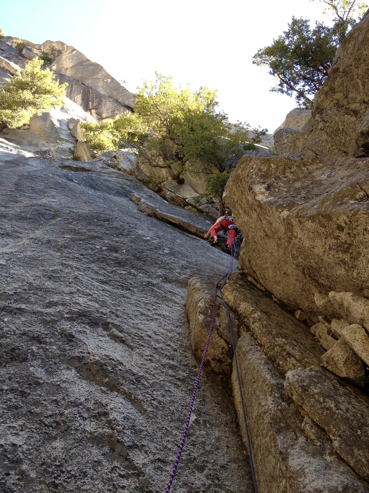 John, climbing the 5.2 first pitch of Super Slide (5.9).