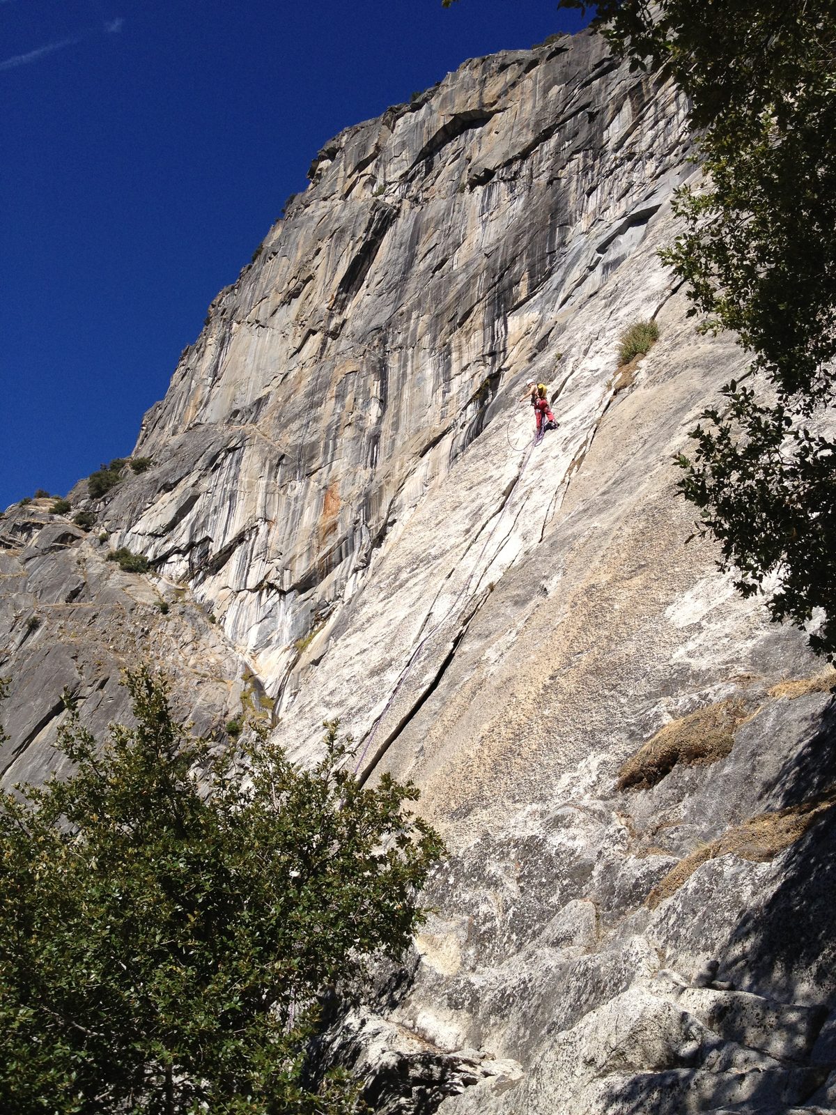 John, pulling up rope at the hanging belay at the top of pitch 3 of Super Slide.