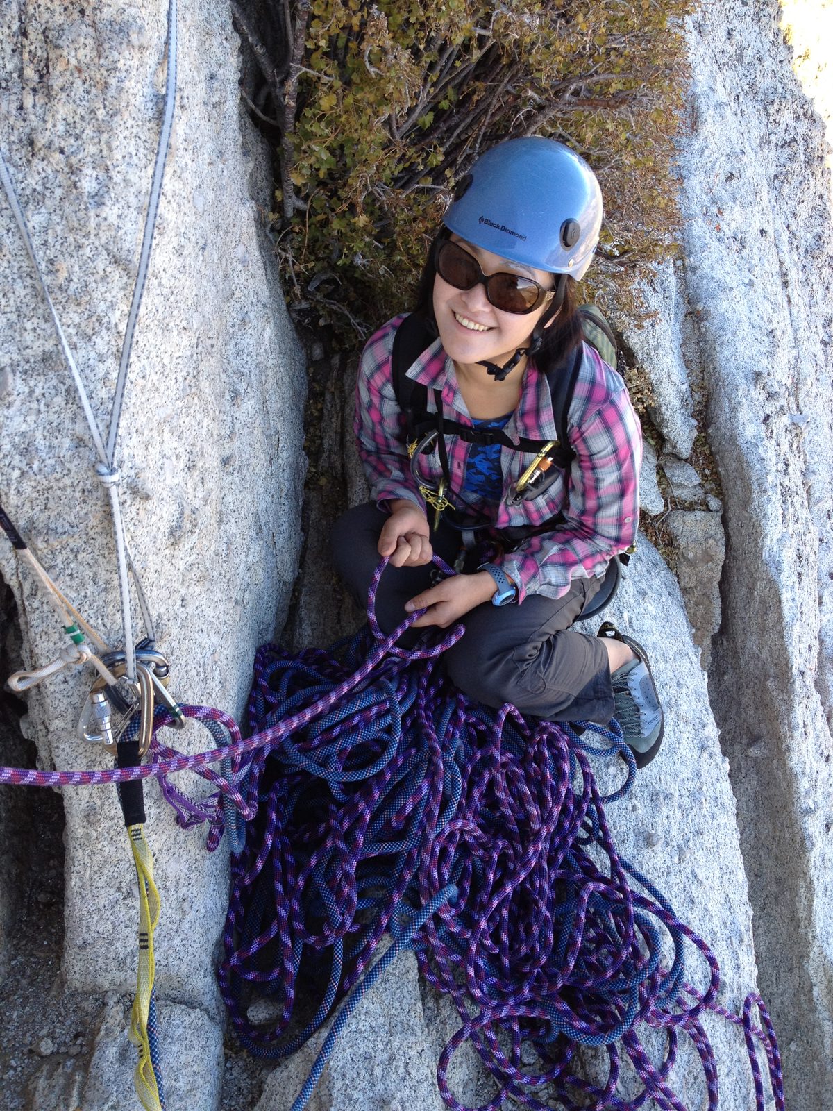 Monica belaying John up the chimney.