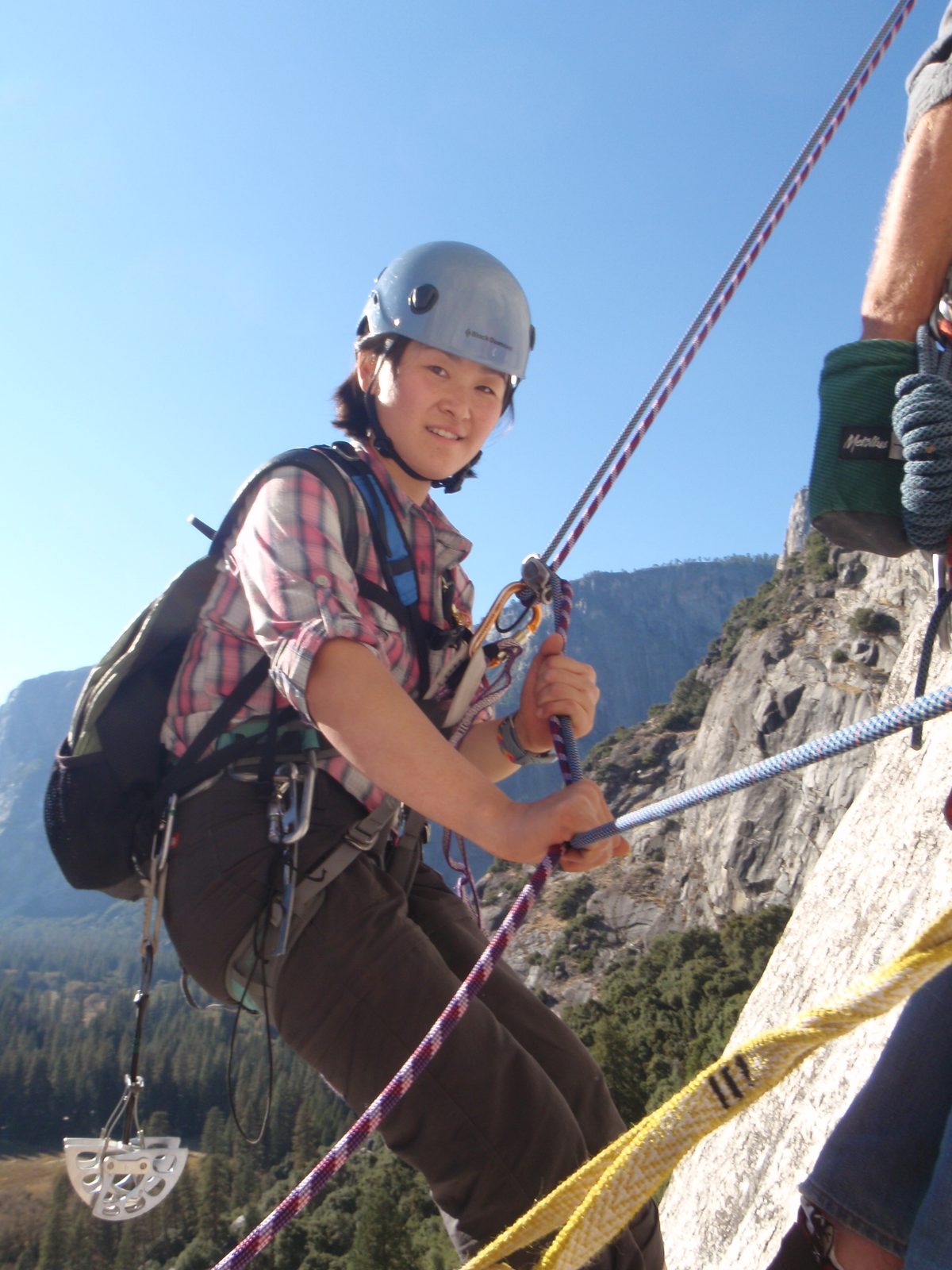 Monica arriving at belay station 3.