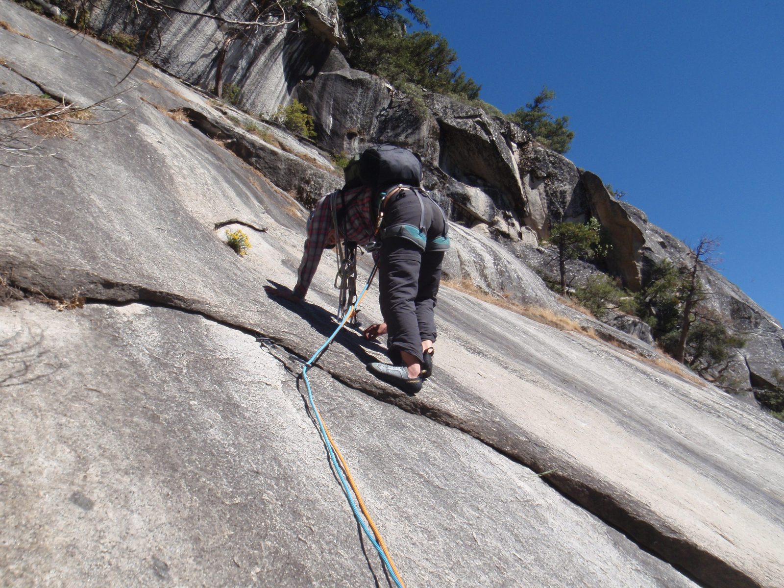 Down-climbing the last ten feet of Royal Arches to regain solid footing in the forest.