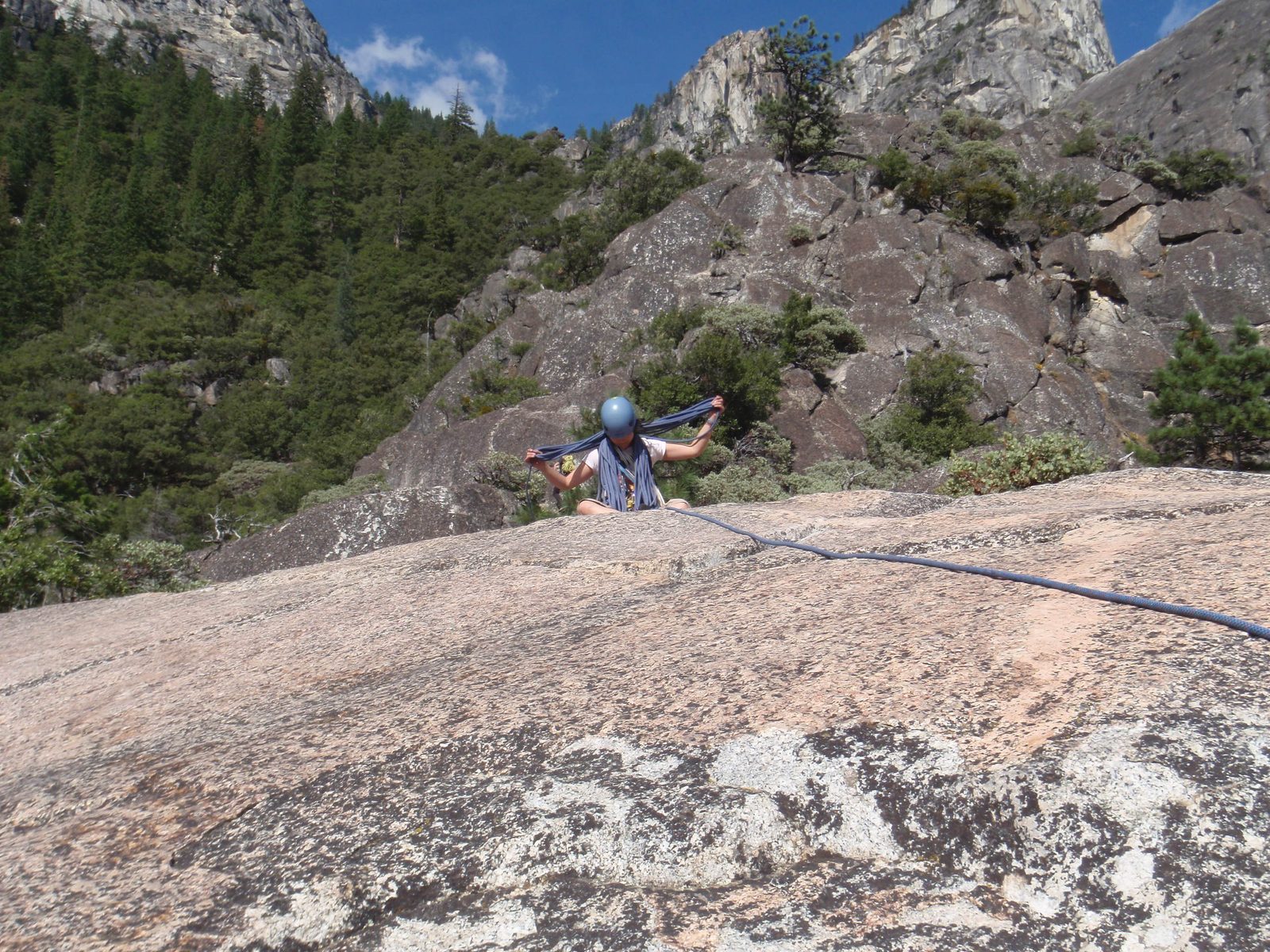 Monica flaking the rope at the top of Manure Pile Buttress.