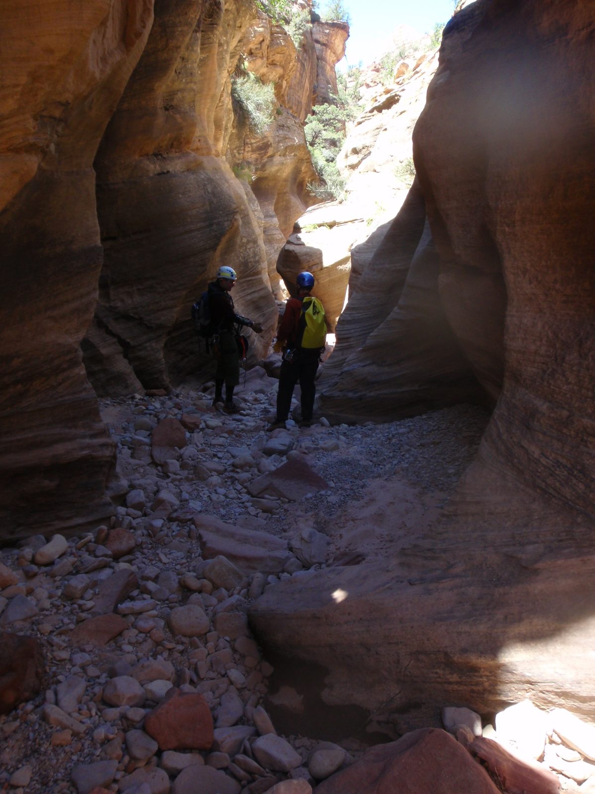 Andy and Joel discussing the first rappel in Pine Creek Canyon.