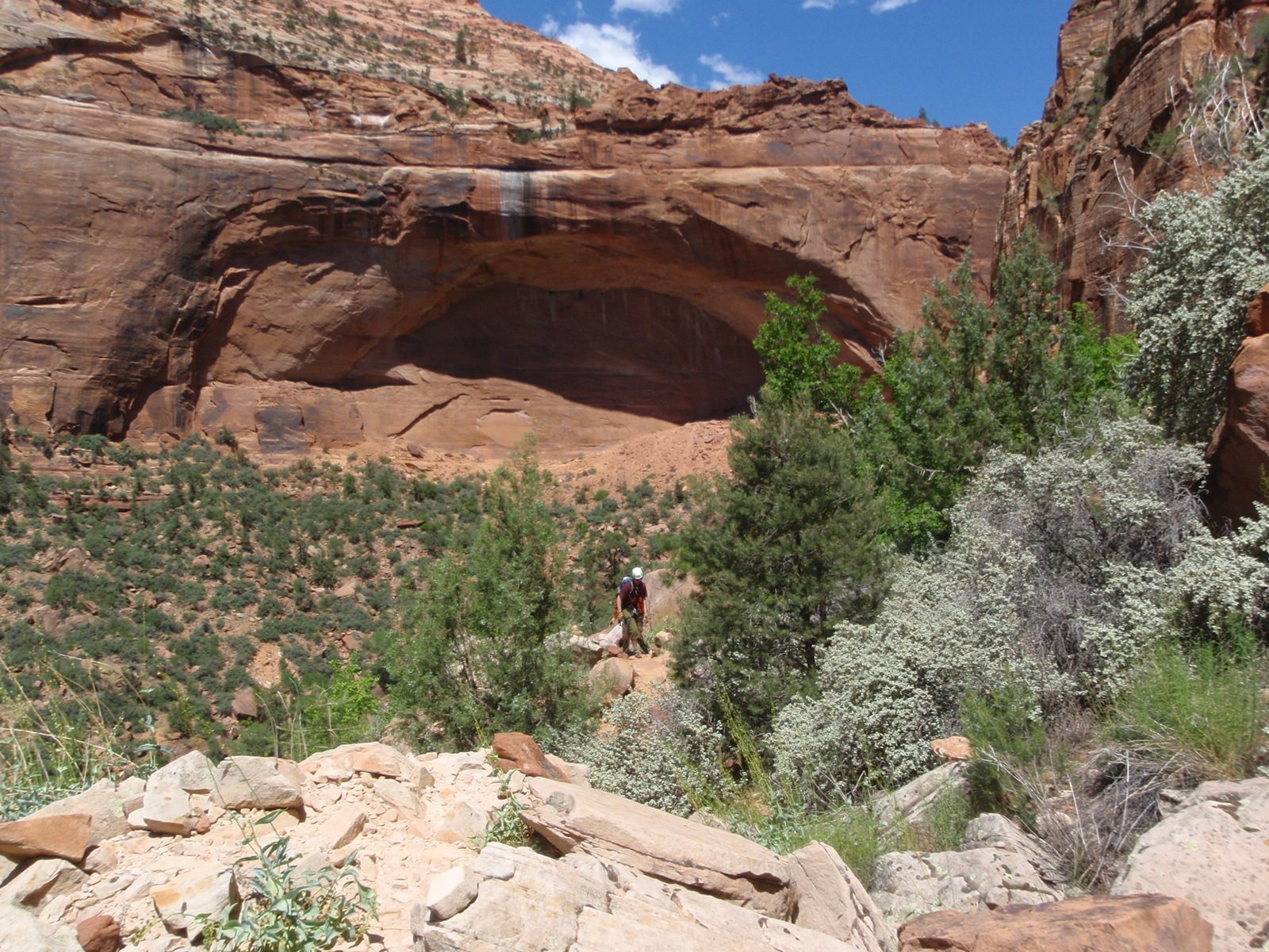 A giant arch on one side of Pine Creek Canyon, and Andy.