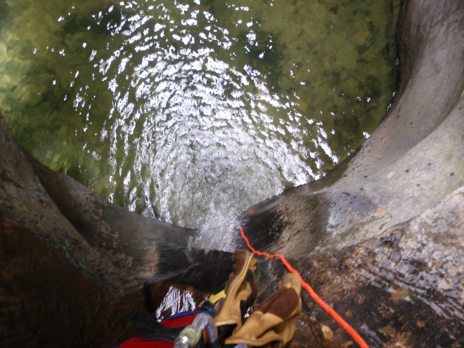 Looking down a rappel into a cold, deep pool.  It is actually a good thing that these pools are...