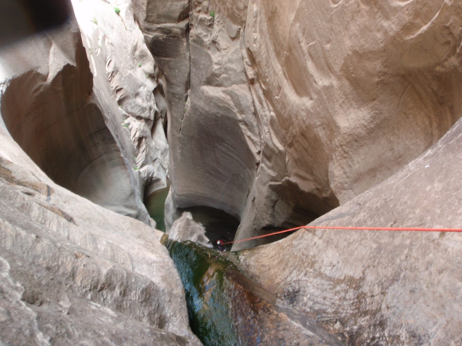 Just about there!  This rappel was a little challenging because it required dropping into a...