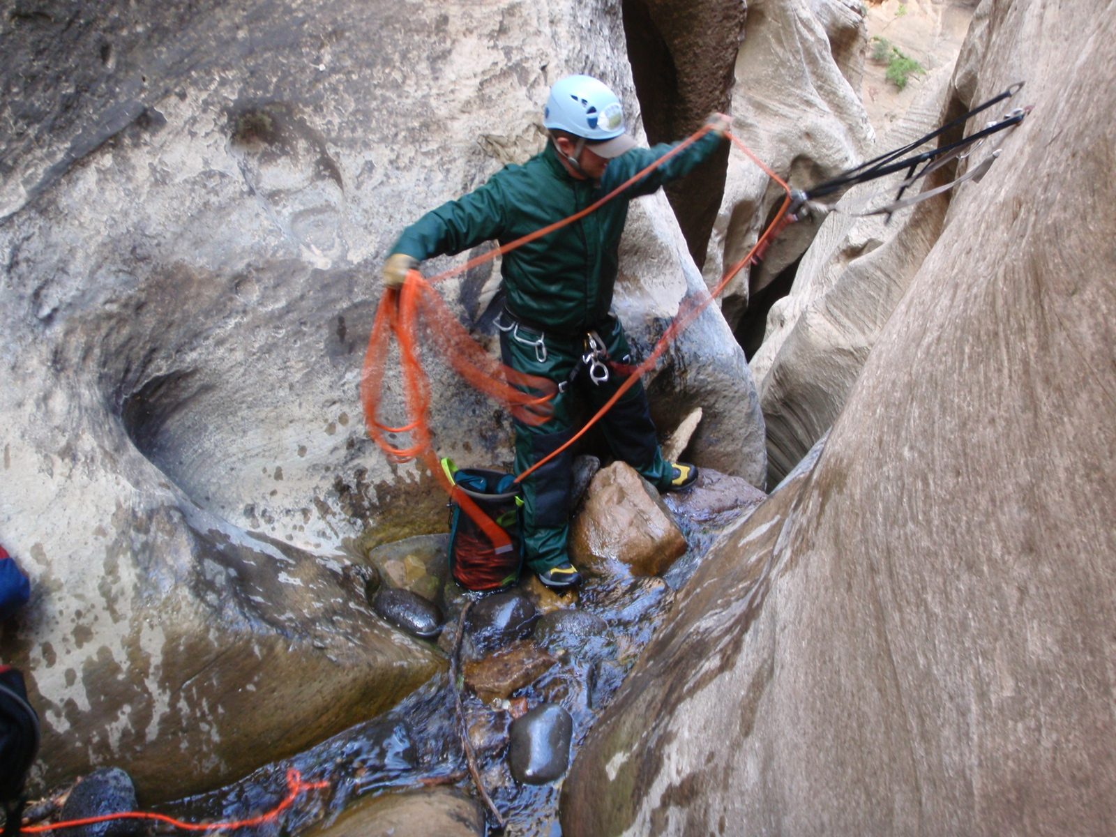Mike pulls rope through an anchor at the top of one of the final rappels.
