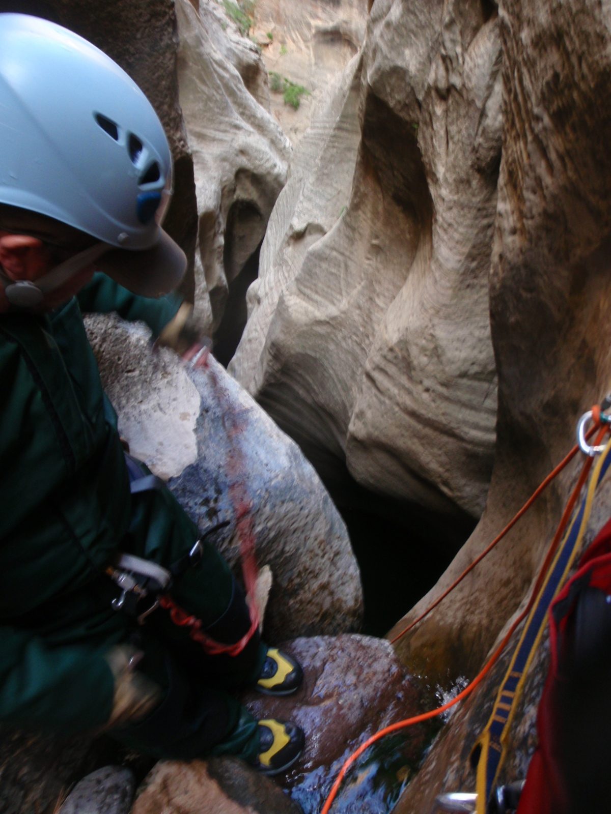 Off into the dark abyss.  Mike prepares to rappel.