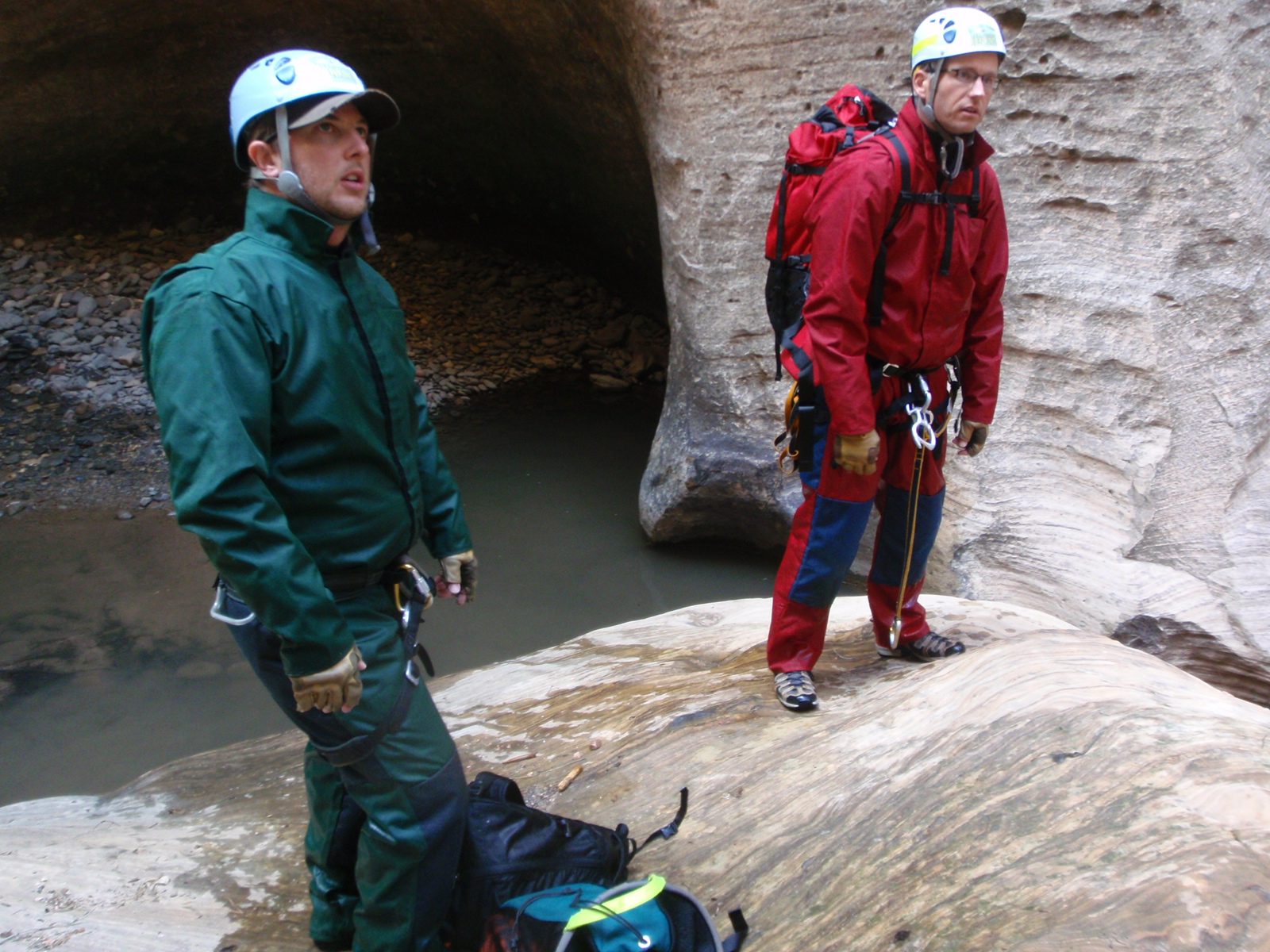 Mike and Andy communicating with Joel as he sets up one of the final big 100+ foot rappels.