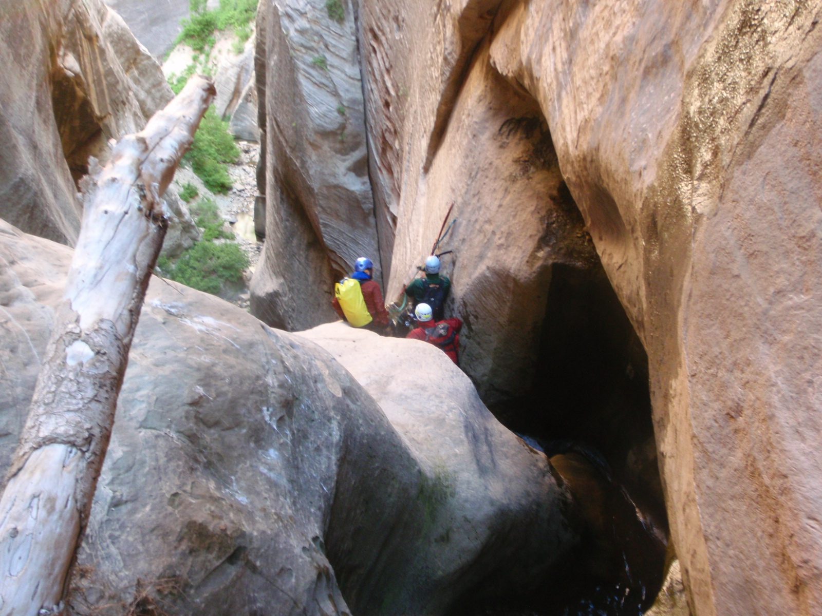 Joel (left), Mike (top) and Andy (bottom) prepare the rigging for the final rappel of the main...