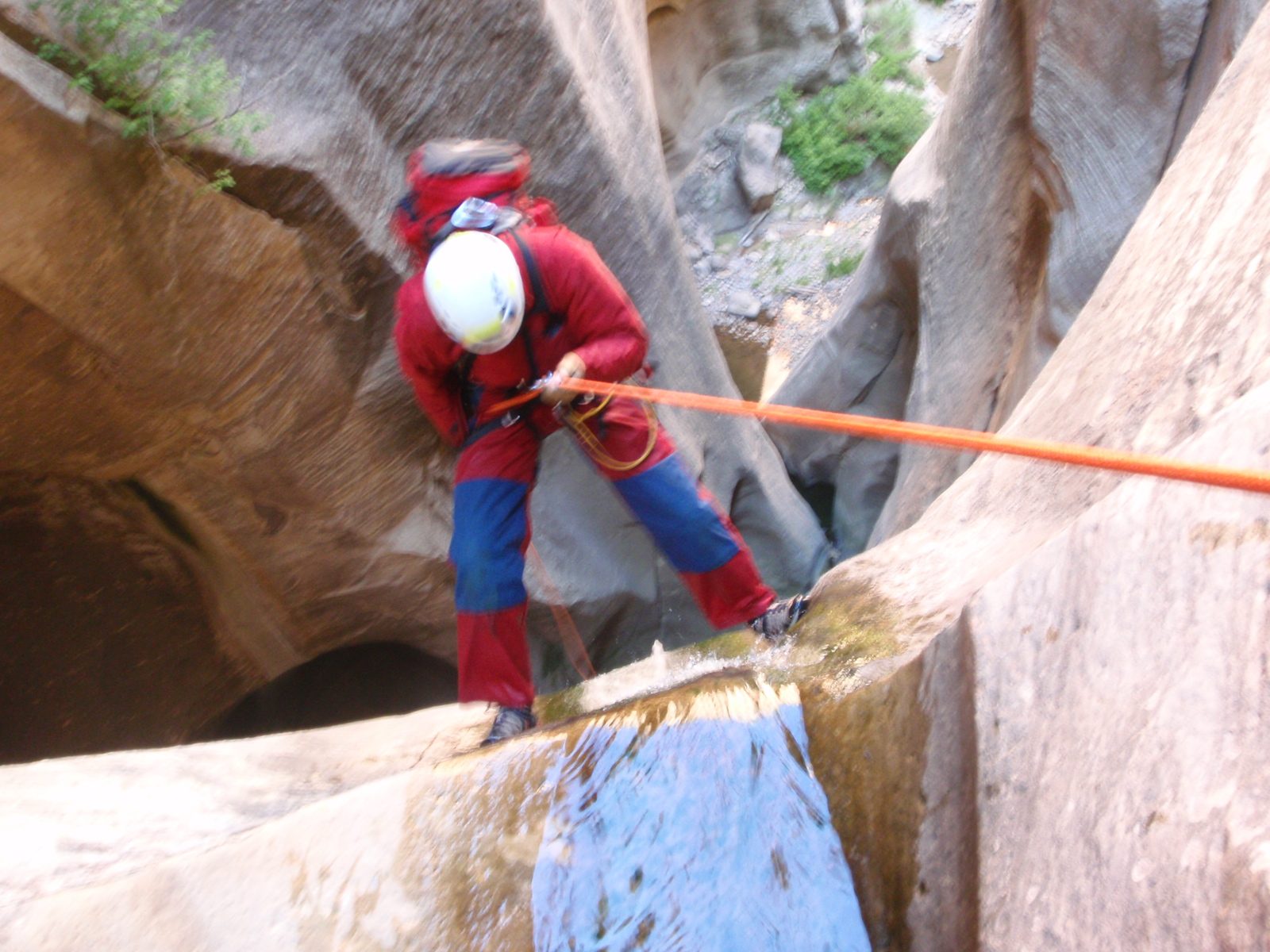 Andy does his best to keep his footing on the moss-covered waterfall.