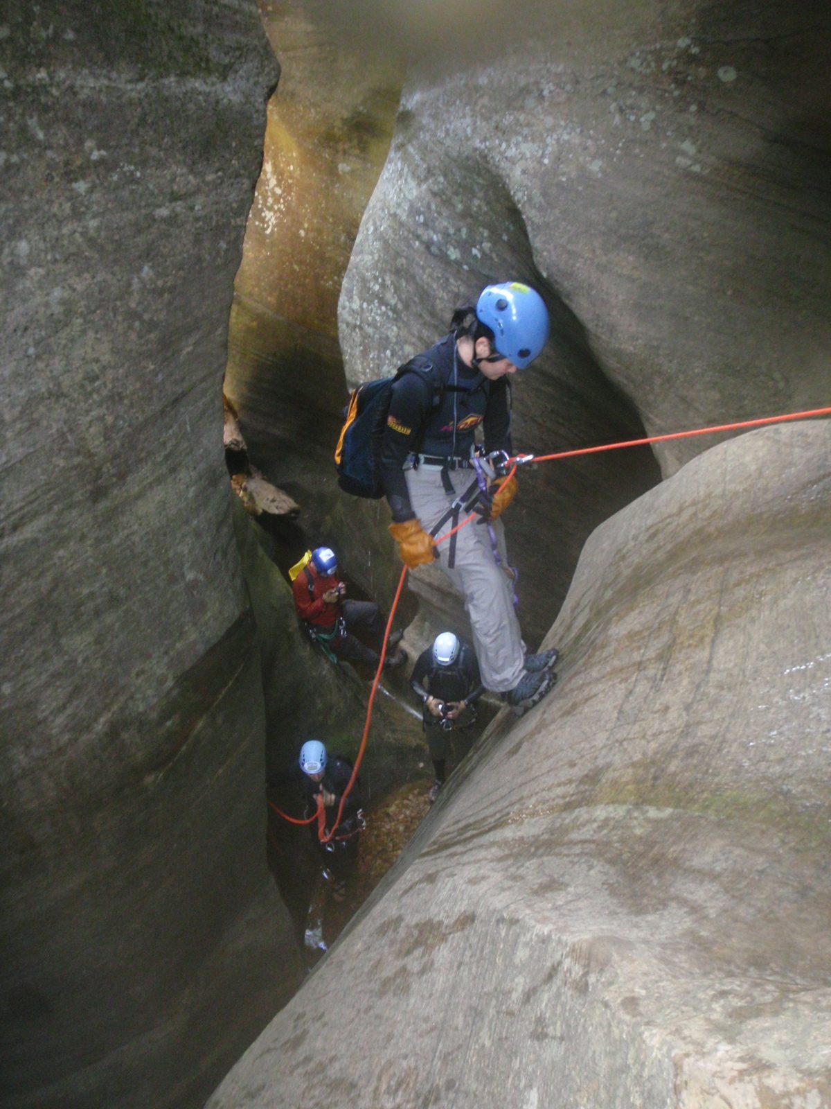 Monica on rappel while Mike gives a belay.