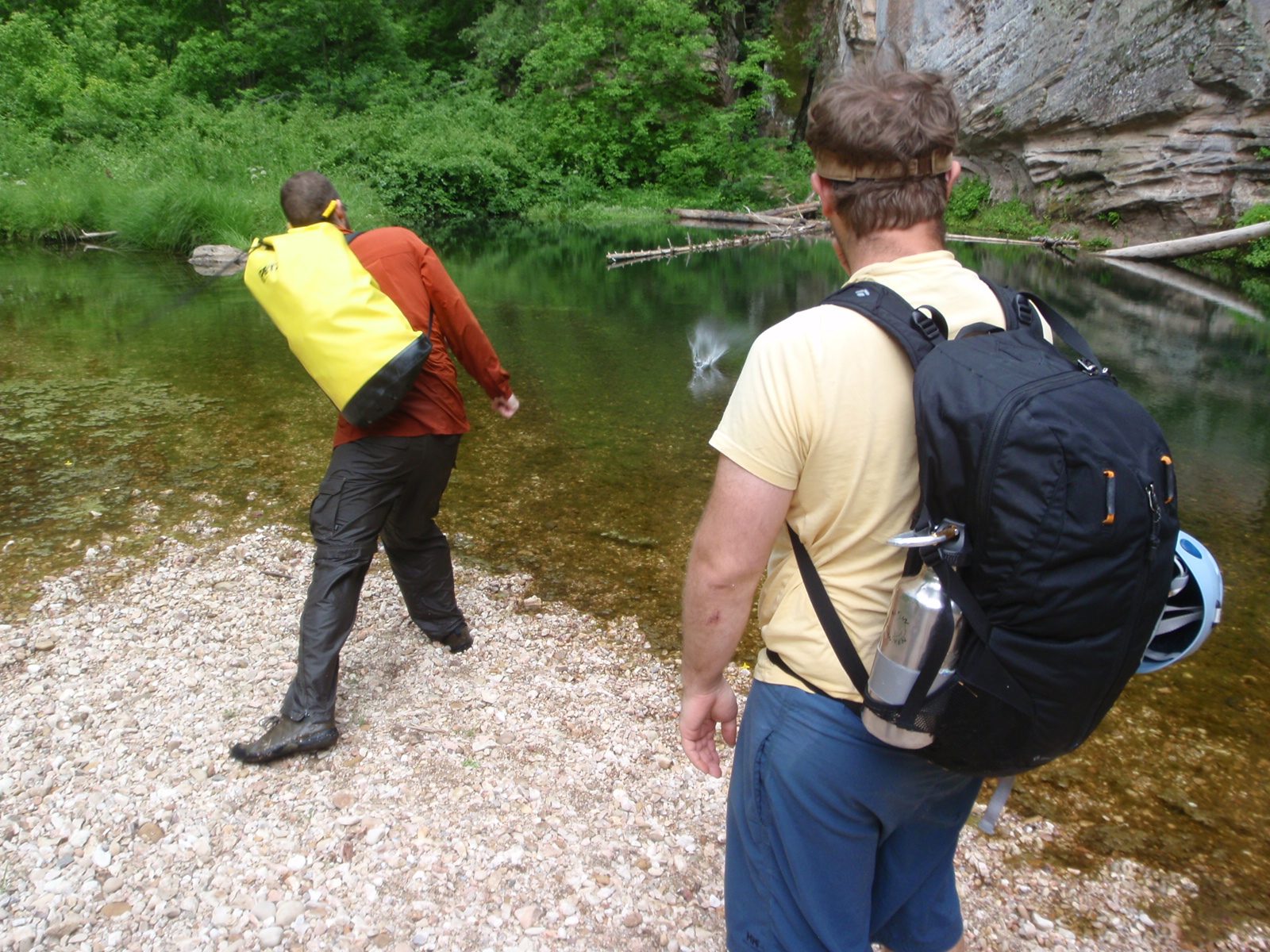 Joel skips a rock while Mike watches.