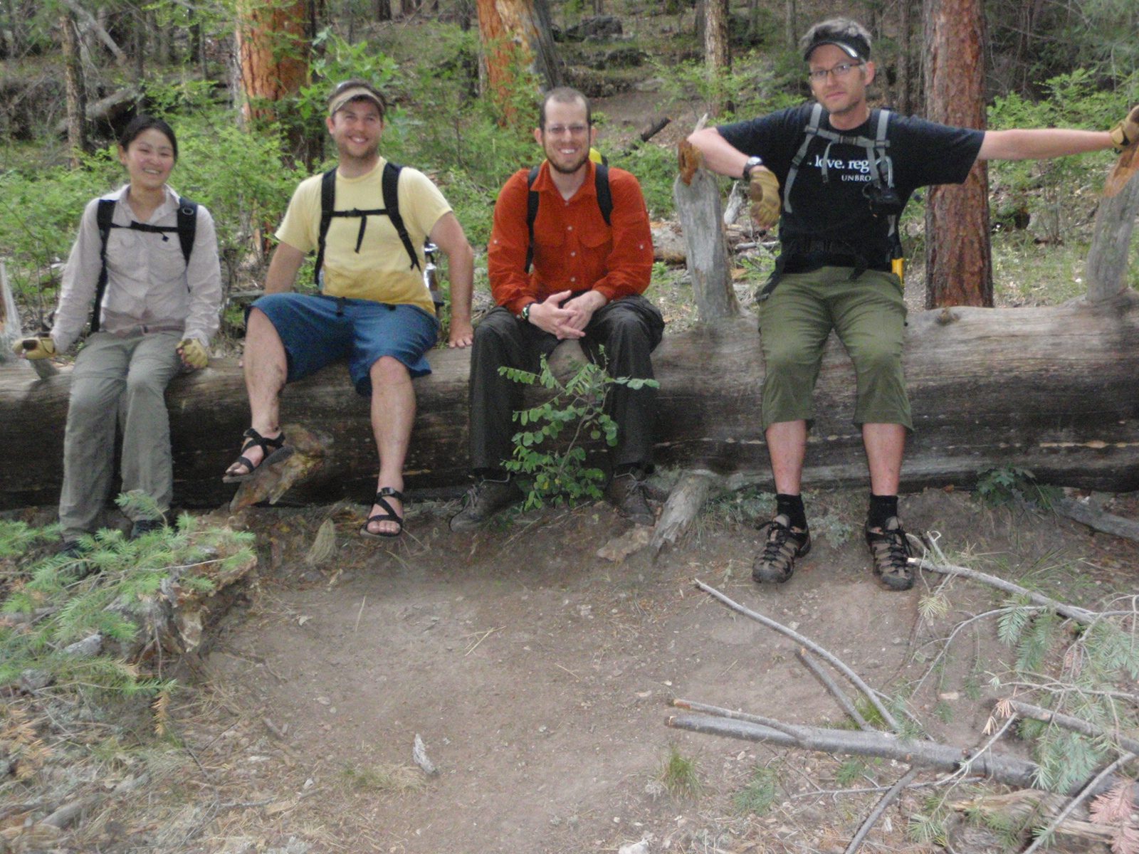 Resting for a minute on a log at the top of the climb out of West Clear Creek Canyon.  Monica,...