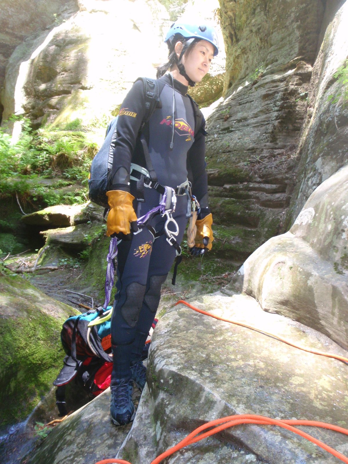 Monica, waiting for the second to last rappel.  We were glad to have our wetsuits on at this...