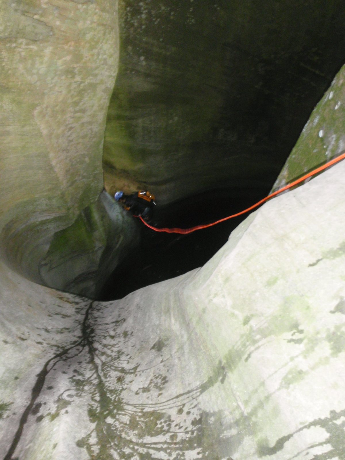 Having swum across the first pothole, Monica scampers up onto dry rock so that she can start the...