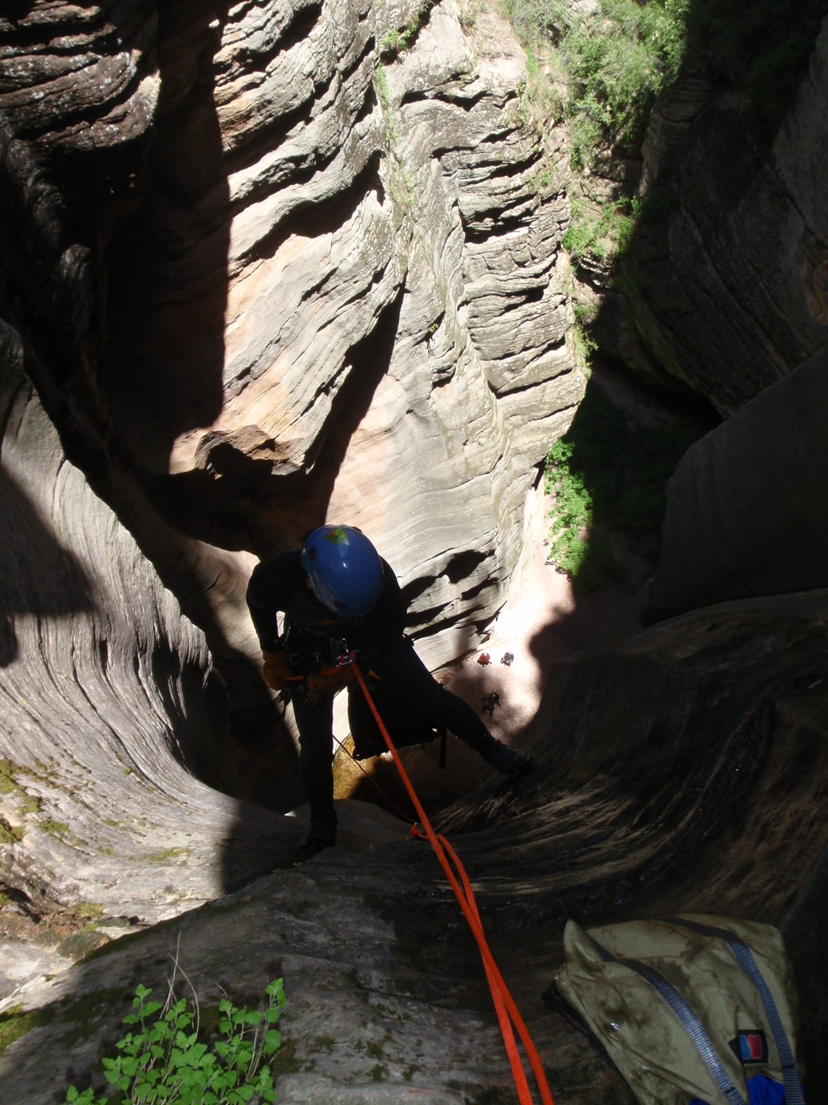 Monica starts working down the upper section of the final 170 foot rappel.  Note for scale Joel,...