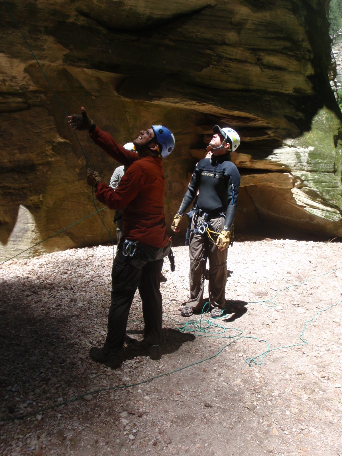 Joel pulls 200+ feet of rope through the anchor with the green pull cord (lying on the ground...