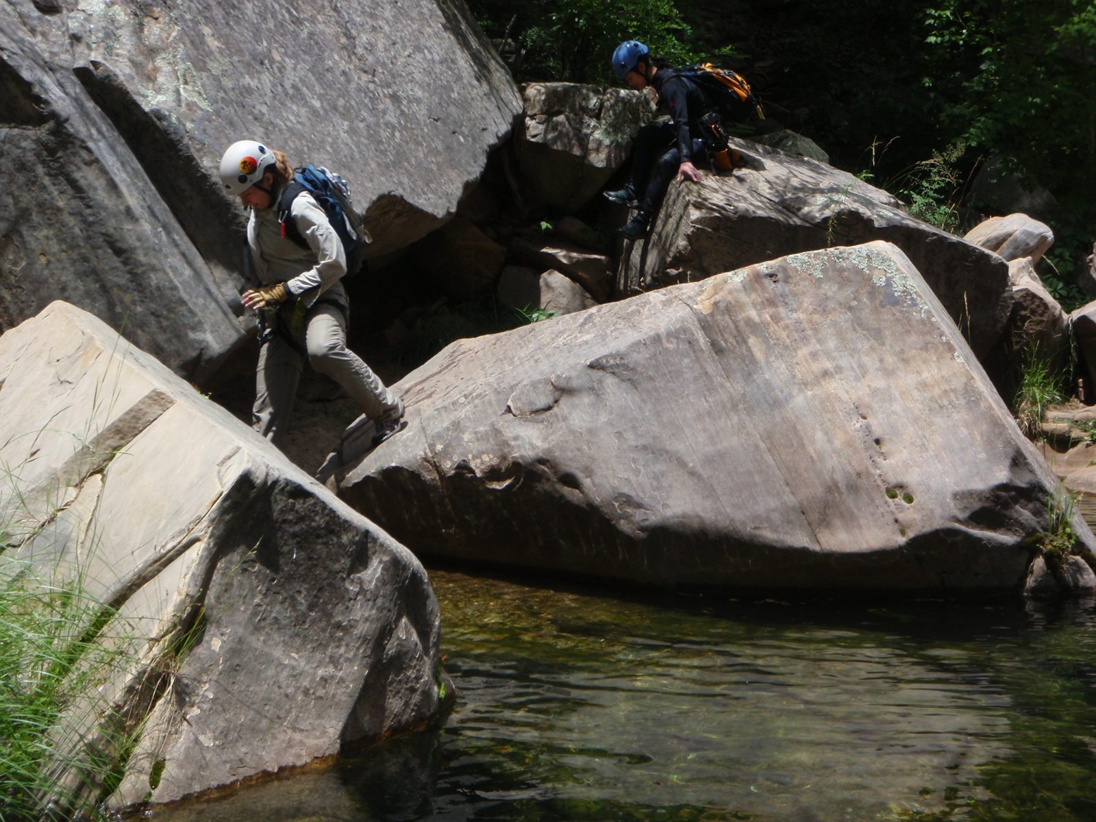 Meredith and Monica boulder-hop downstream in West Clear Creek.
