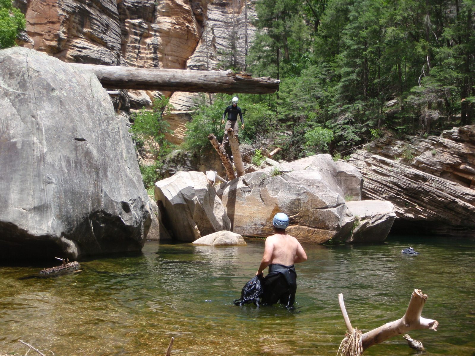 Andy slowly shuffles out onto the super bouncy double-diving board, while Mike wades in the water.