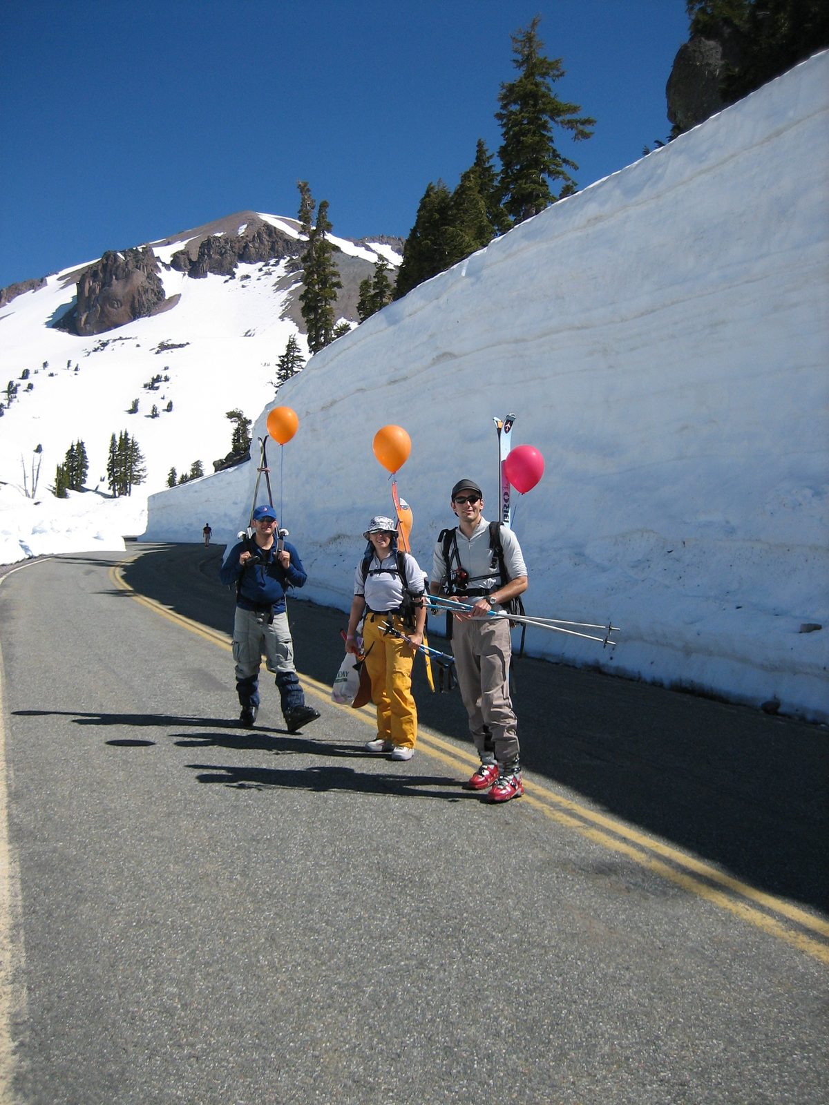 Niels, Catherine, and some guy hike up the (closed) road Saturday morning.  Lassen is in the background.