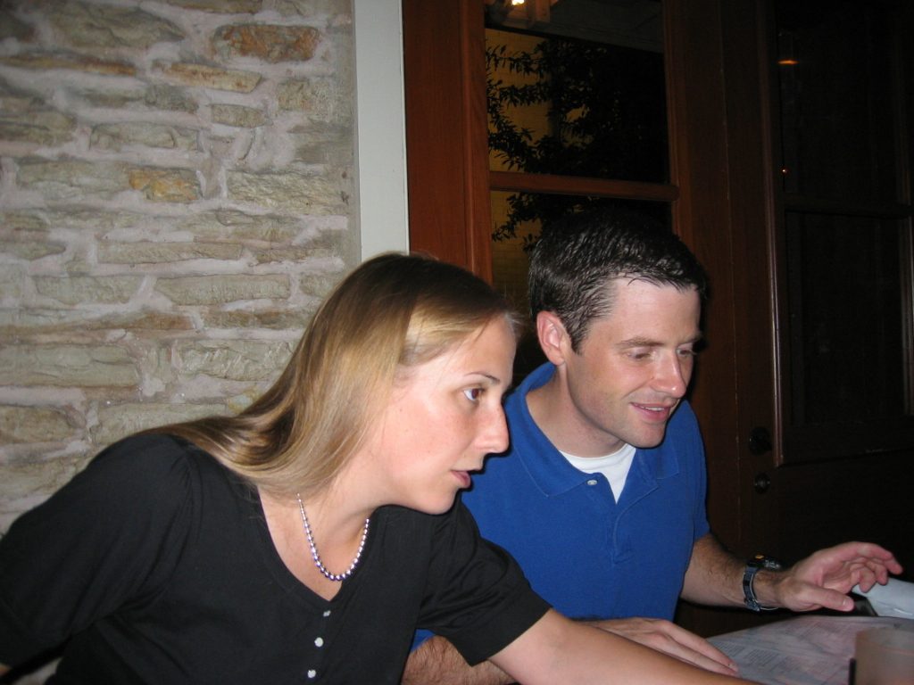 Catherine making a point at that great restaurant down town named Moonshine while Jay studies the menu.