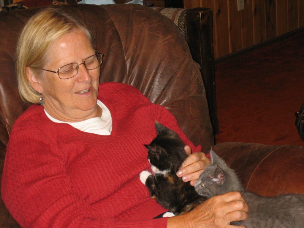 Mon wondering whether "Boots" or "Chevy" should come home with her.  (Guess which one is Boots)