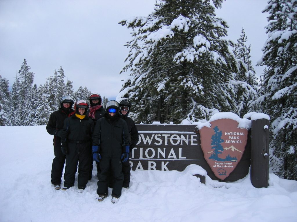 The family bundled up, piked up our (rented) snowmobiles, and headed into Yellowstone National...