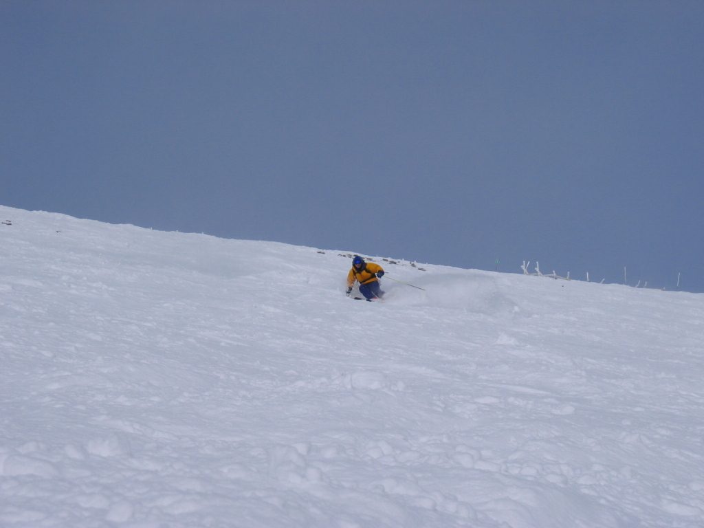 John skiing down through some okay powder.  Not bad for midafternoon on such a gorgeous day.