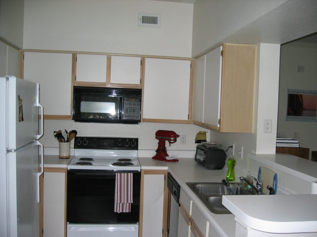 Kitchen showing off the red Kitchen Aid mixer.