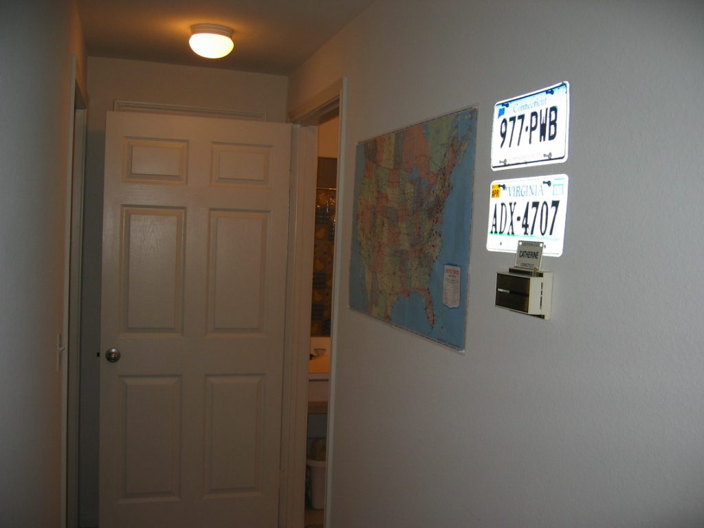 Down the hallway which features 'dotted' US map and license plates